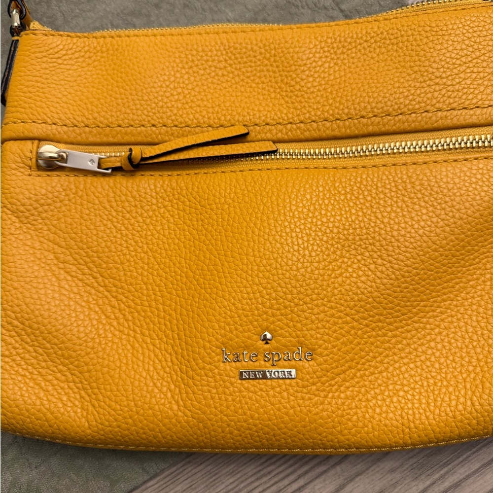 Kate Spade, new with storage bag.  Never used.